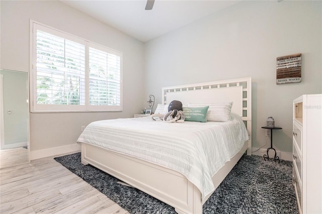 bedroom with hardwood / wood-style flooring and ceiling fan