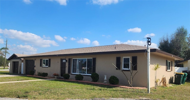 181 Coconut St, Punta Gorda, FL 33980 - ranch-style house featuring a garage and a front lawn