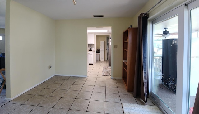 hall with light tile patterned flooring