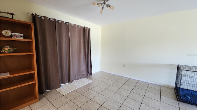 spare room featuring light tile patterned flooring