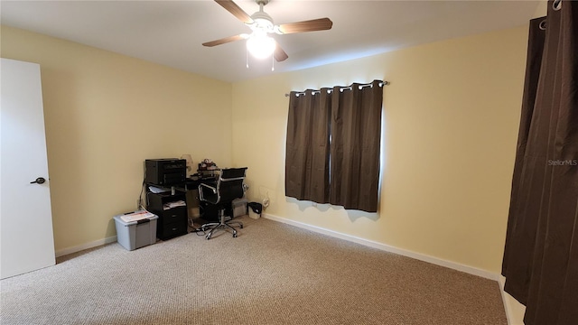 home office with light carpet and ceiling fan