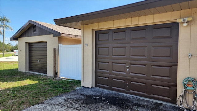 garage featuring a yard