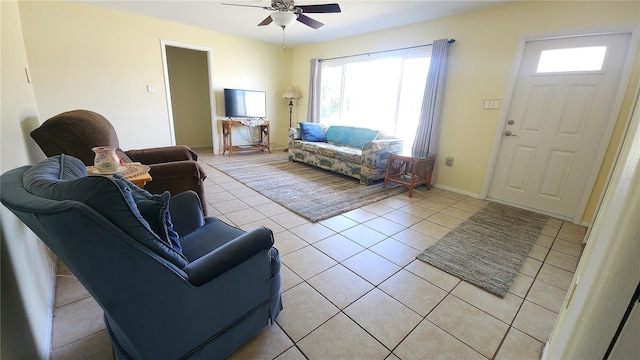 living room featuring ceiling fan and light tile patterned flooring