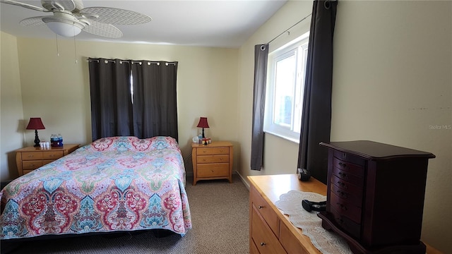 bedroom featuring light colored carpet and ceiling fan