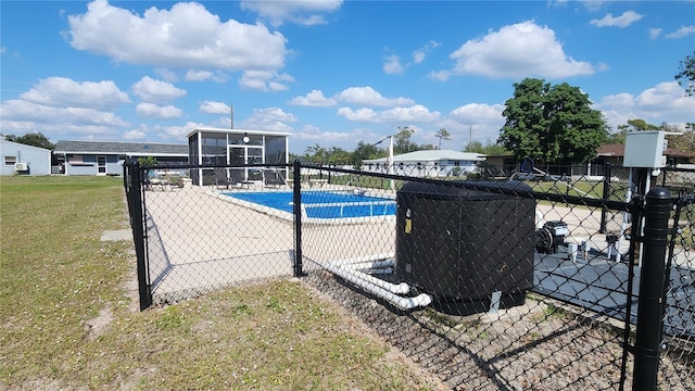 view of swimming pool with a patio area and a lawn