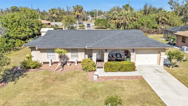 single story home featuring a garage and a front lawn