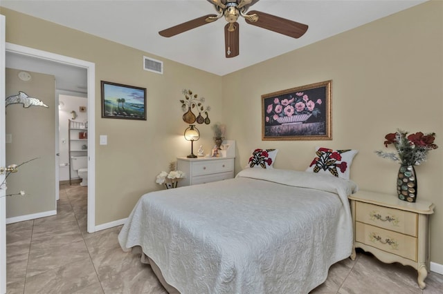 bedroom with ceiling fan and tile patterned flooring