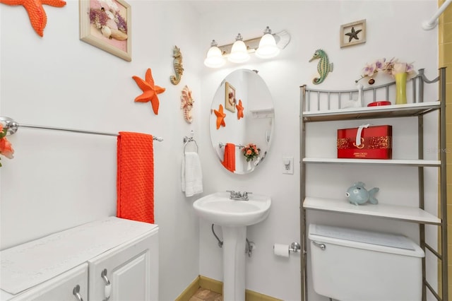 bathroom with sink and toilet