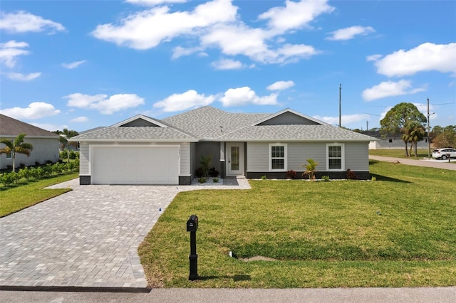 ranch-style home with a garage and a front lawn