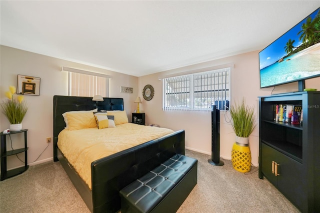 bedroom featuring light colored carpet