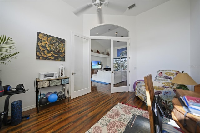 office featuring dark hardwood / wood-style floors, built in features, and french doors