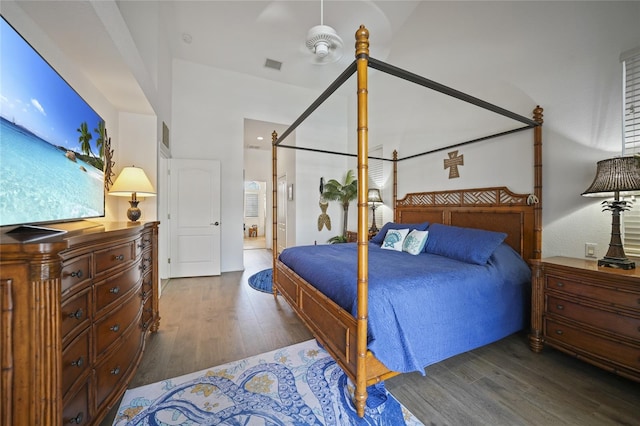 bedroom with dark hardwood / wood-style flooring