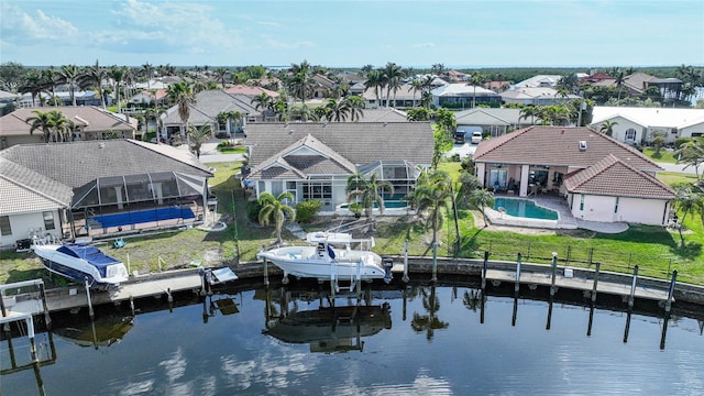 birds eye view of property with a water view