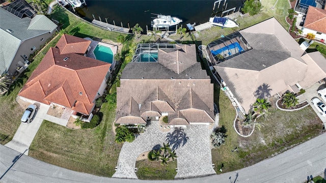 birds eye view of property with a water view