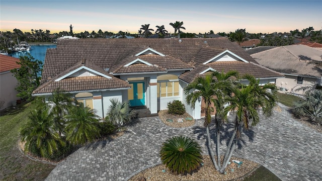 view of front of property with a water view