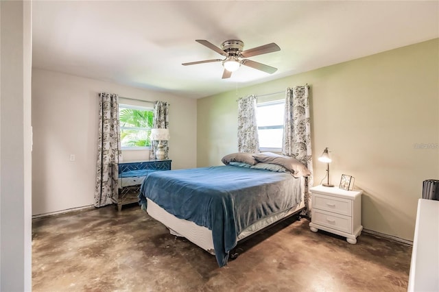 bedroom with multiple windows and ceiling fan