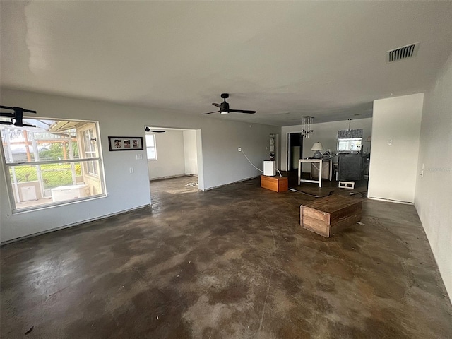 9656 SW Marina Dr, Arcadia, FL 34269 - unfurnished living room with unfinished concrete floors and a ceiling fan