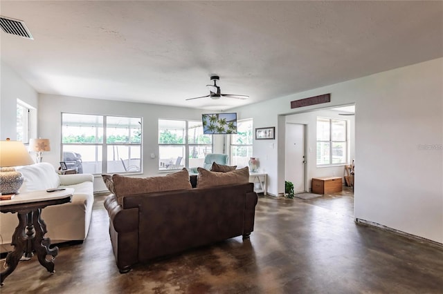 9656 SW Marina Dr, Arcadia, FL 34269 - living room with plenty of natural light, ceiling fan, and finished concrete floors