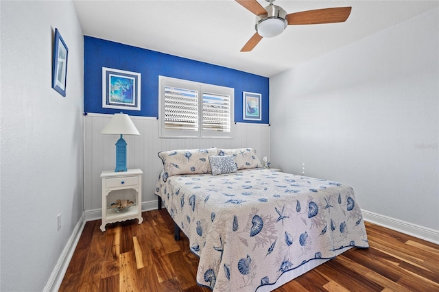 bedroom with ceiling fan and dark hardwood / wood-style flooring