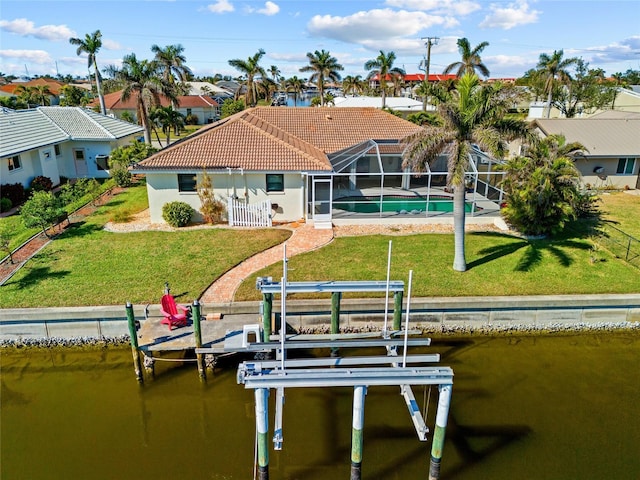 view of dock featuring a water view, a yard, a fenced in pool, and glass enclosure