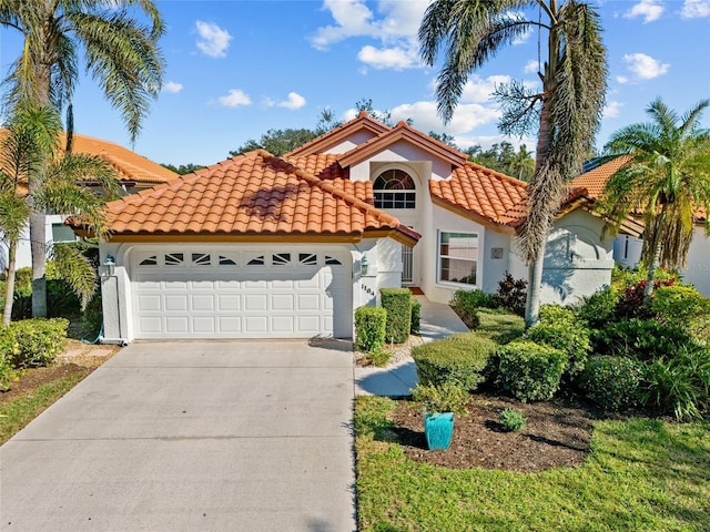 mediterranean / spanish-style home featuring a garage