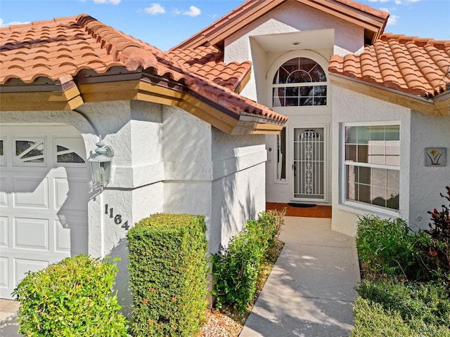 doorway to property featuring a garage