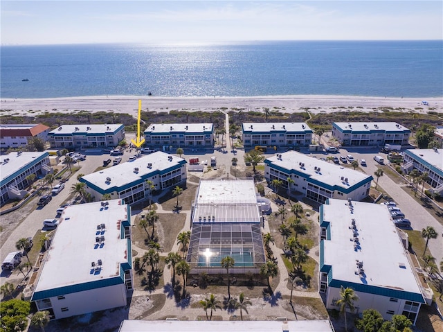 bird's eye view featuring a view of the beach and a water view