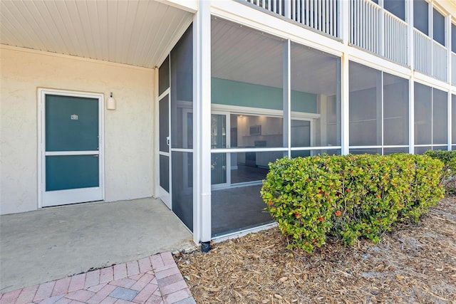 doorway to property with a patio