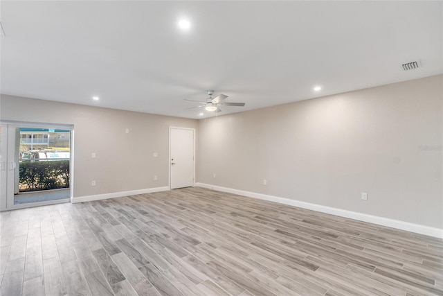 unfurnished room with ceiling fan and light hardwood / wood-style floors