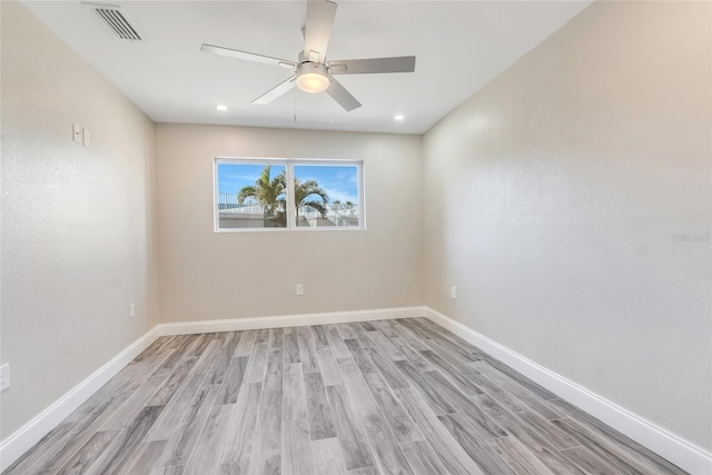 empty room with light hardwood / wood-style flooring and ceiling fan