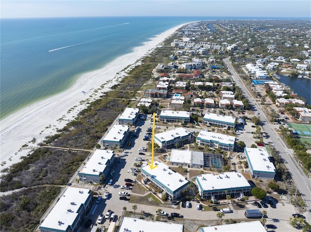 bird's eye view with a water view and a view of the beach