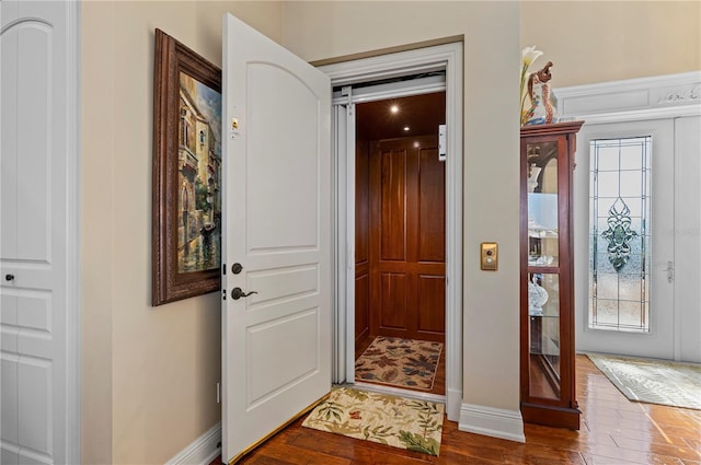 foyer featuring dark hardwood / wood-style floors