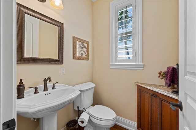 bathroom with sink and toilet