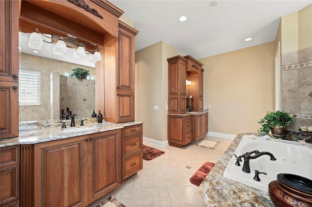 bathroom with vanity, tile patterned floors, and a tub