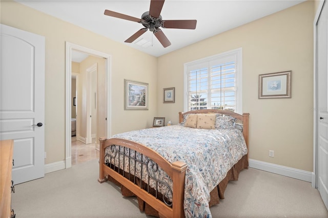 carpeted bedroom with ceiling fan