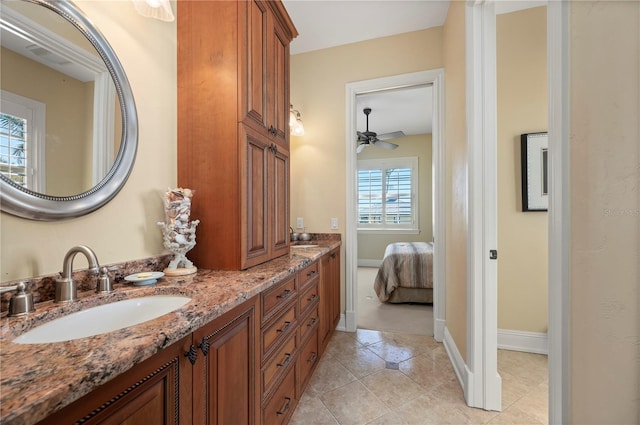 bathroom with tile patterned flooring and vanity