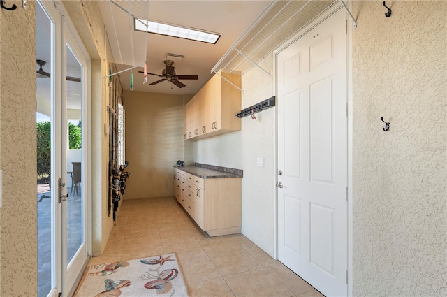 interior space with light tile patterned floors