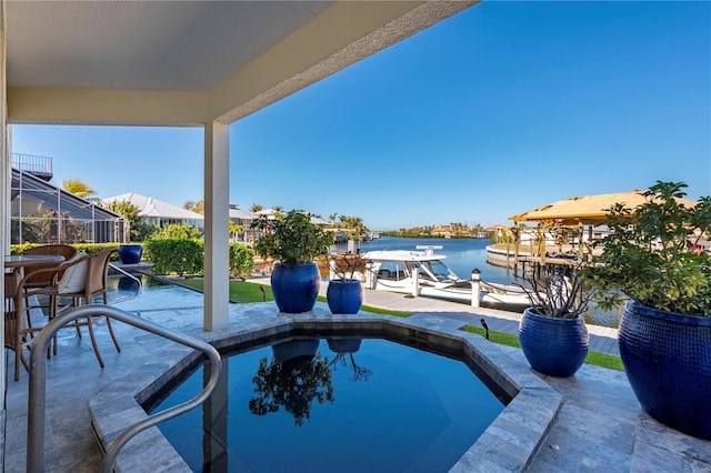 view of swimming pool featuring a water view, a lanai, and a boat dock