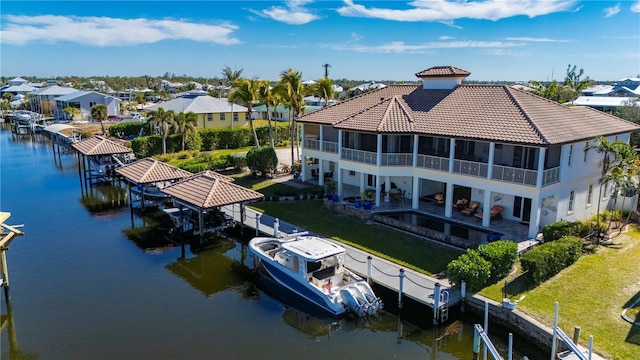 birds eye view of property featuring a water view