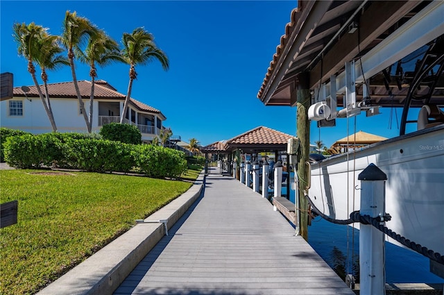 dock area featuring a lawn