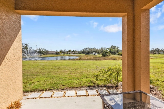 view of yard with a water view