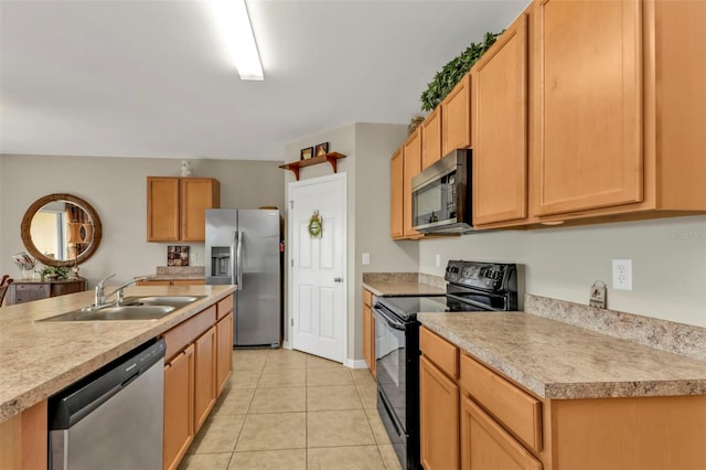 kitchen featuring stainless steel appliances, sink, and light tile patterned floors