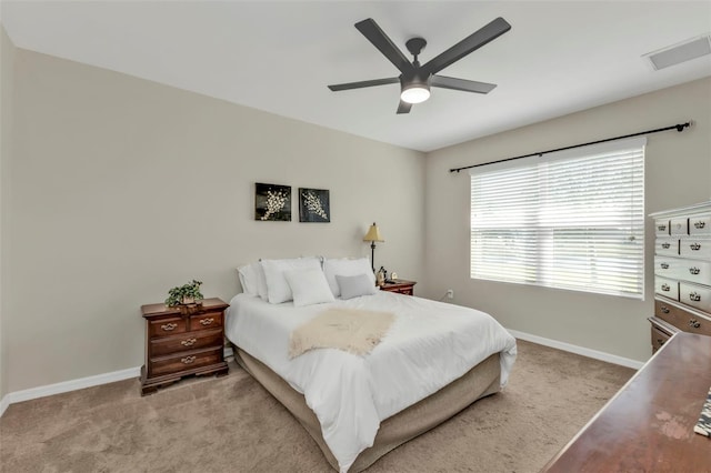 bedroom with light carpet and ceiling fan