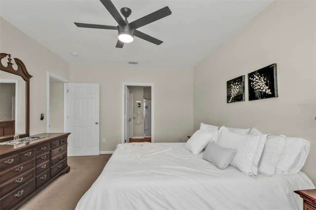 carpeted bedroom featuring ceiling fan and ensuite bath