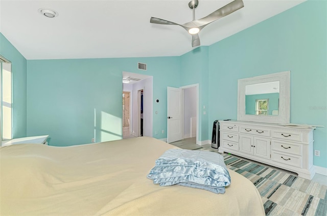 bedroom featuring lofted ceiling and ceiling fan