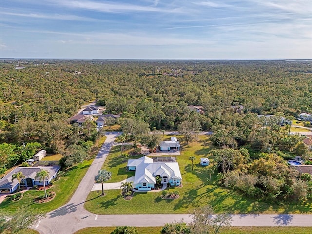 aerial view featuring a wooded view