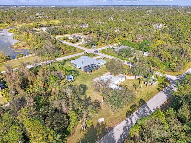 drone / aerial view featuring a view of trees