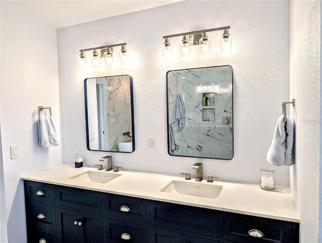 bathroom with a sink and double vanity