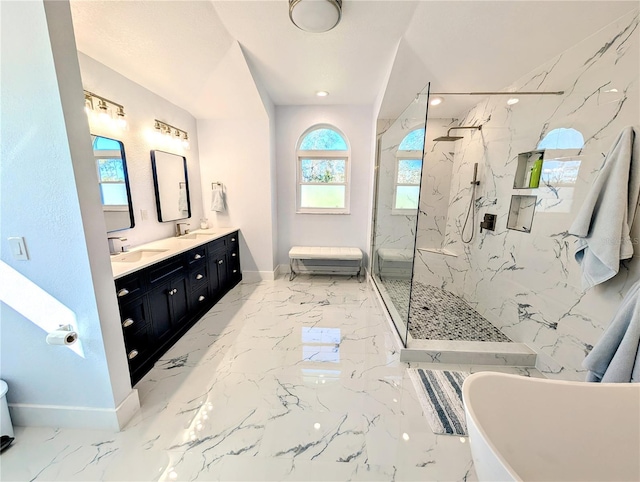 full bathroom featuring marble finish floor, a sink, and a marble finish shower