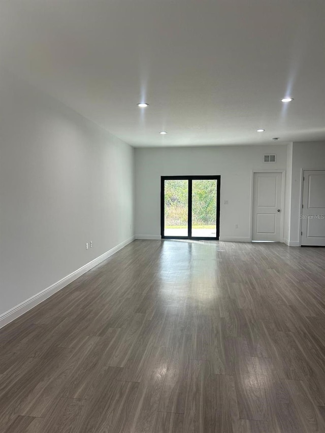 empty room featuring dark wood-type flooring